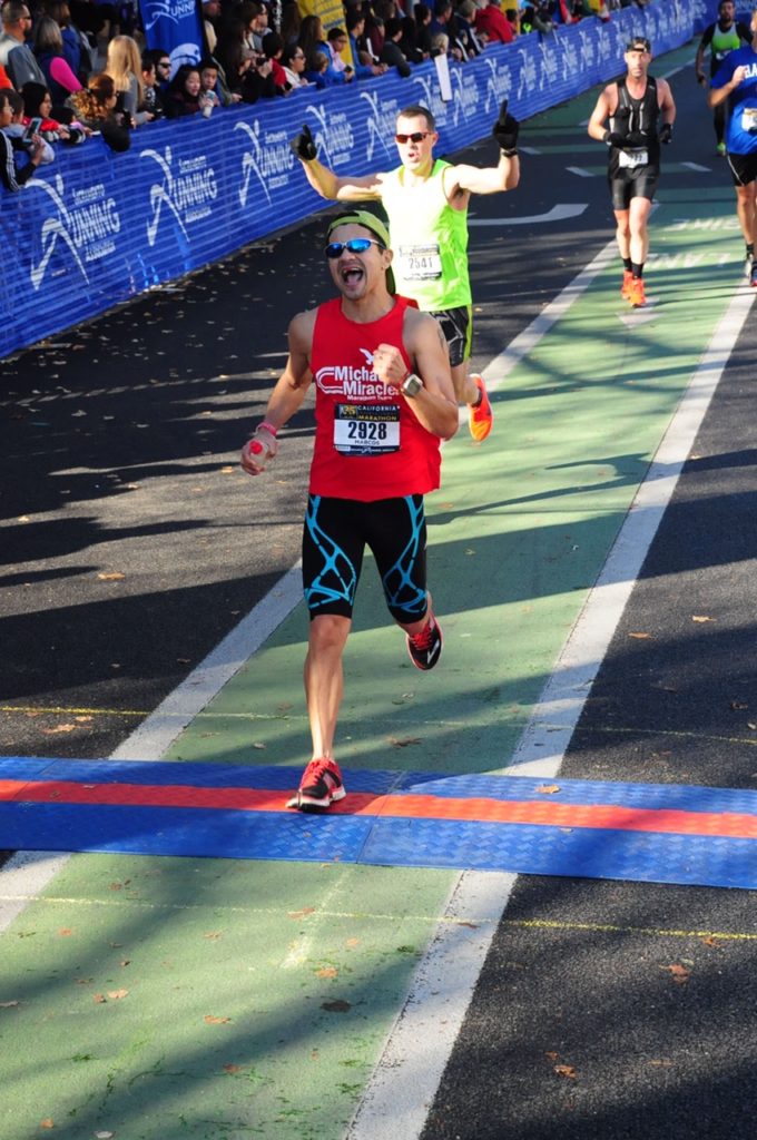 Marcos crossing the finish line with a look of joy! 2017 Sacramento - best time and BQ!