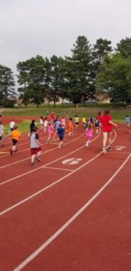 Kids running track.  Because that never gets old.
